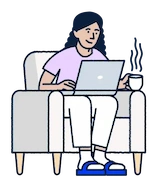 Person sitting on a couch with a laptop and a cup of coffee.